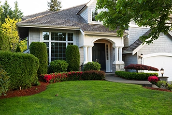 Suburban home with landscaping and flowers